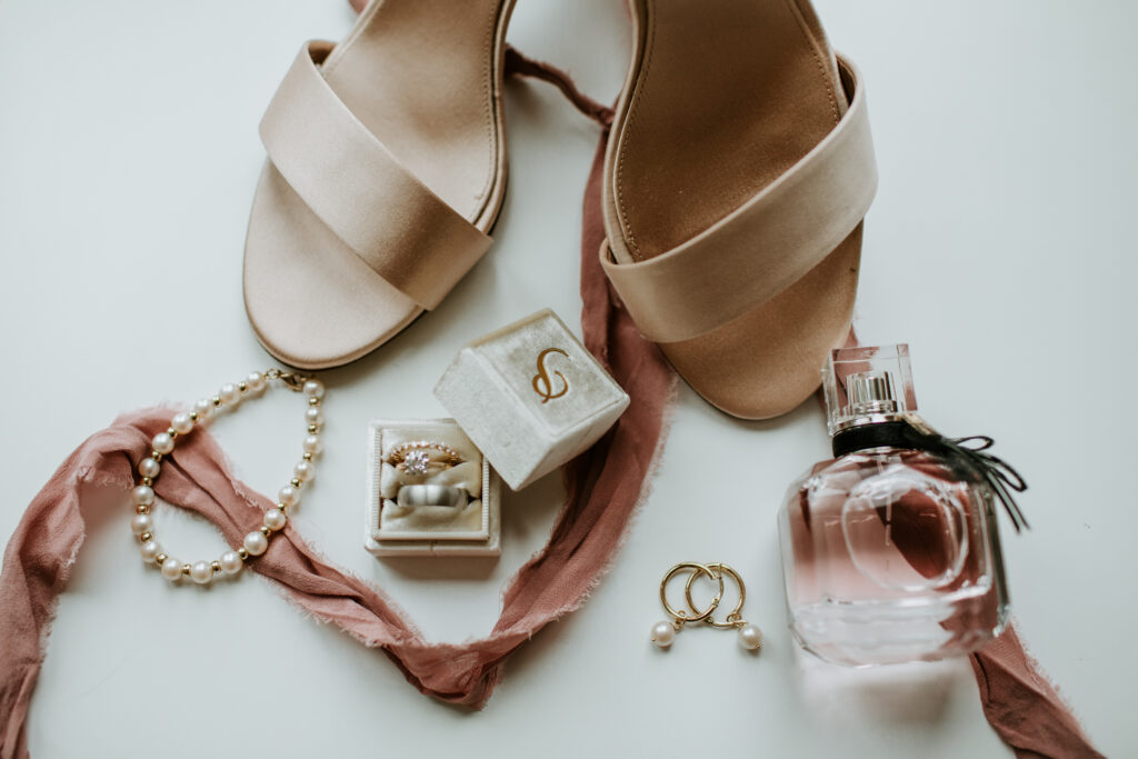 Wedding day details, jewelry, perfume, satin shoes